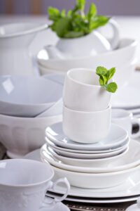 Variety of white dinnerware: plates, cups and bowls